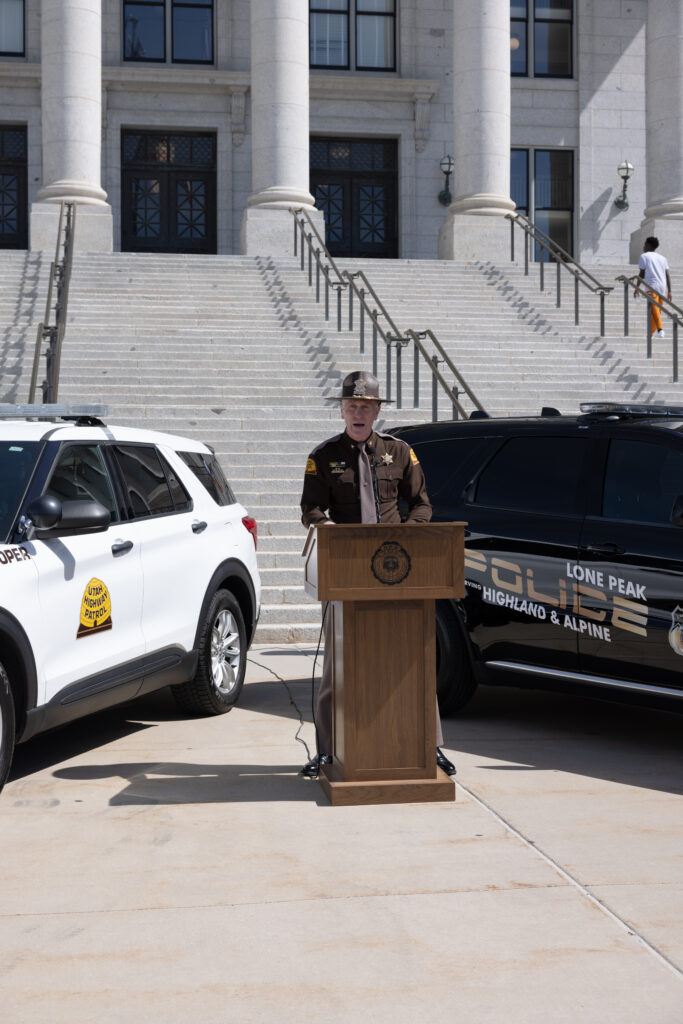 UHP Colonel Rapich speaks at the podium
