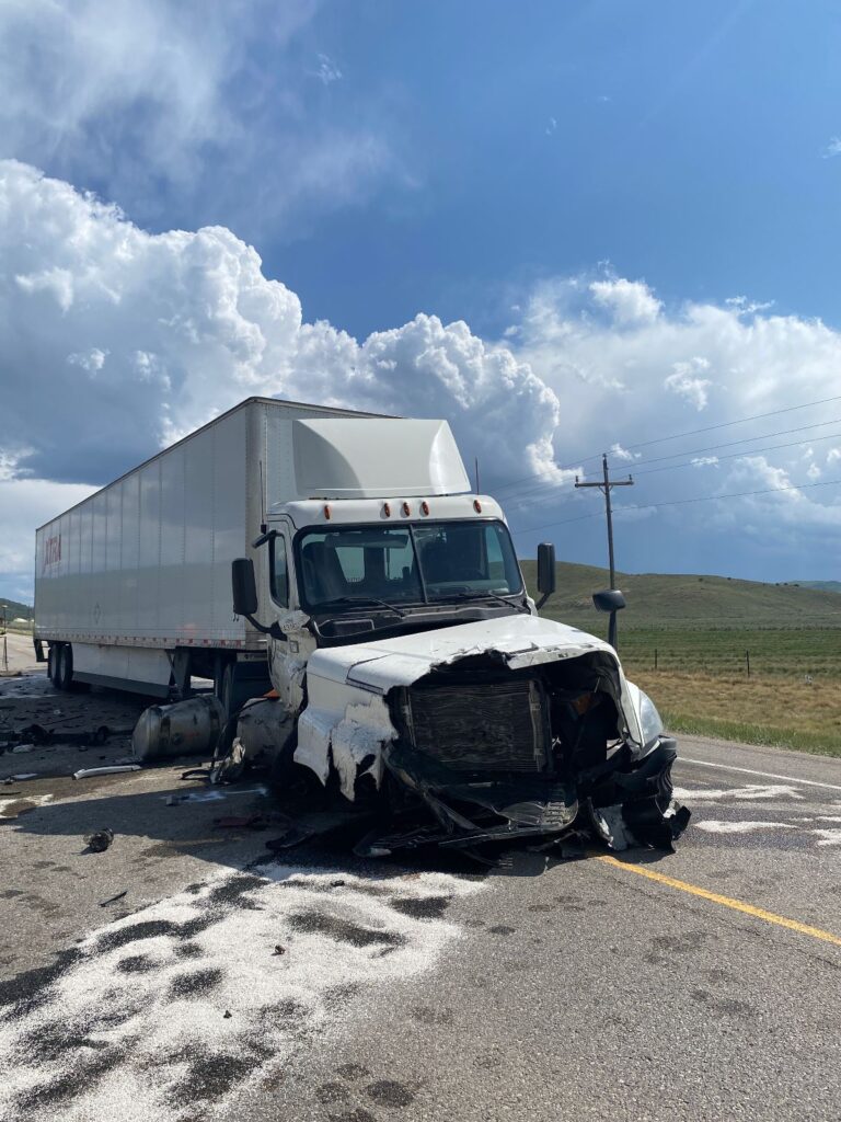 Semi truck with front end damage on Highway 89