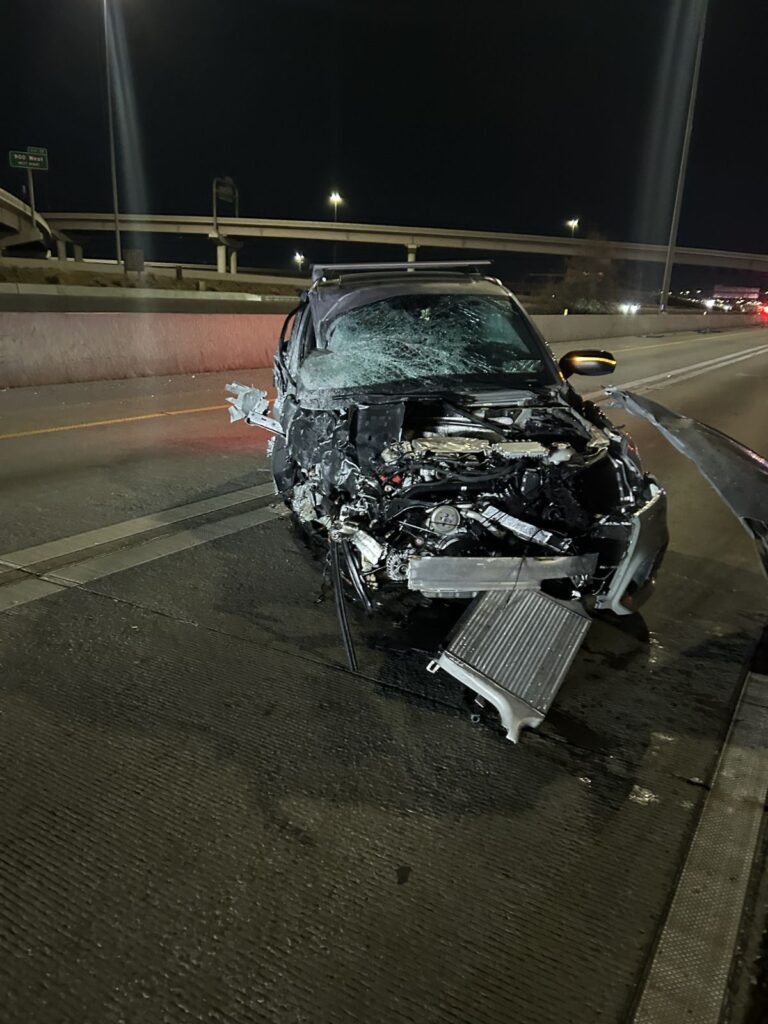 Audi SQ5 with severe front end damage on I-15